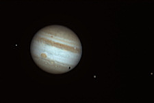 Jupiter and Europa, Ganymed (casting a shadow) and Io: October 9, 2010